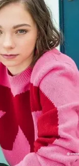 Pink sweater with bold red pattern, perfect for a trendy mobile wallpaper.