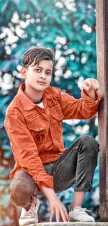 Stylish young person poses on a beam with a vibrant background.