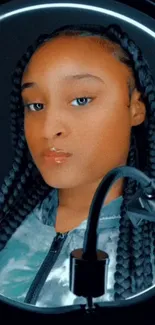 Stylish portrait of woman with braided hair in dark background.