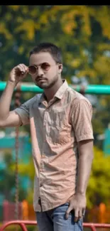 Young man with sunglasses in a stylish outdoor wallpaper.