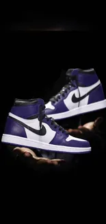 Stylish purple sneakers floating in dark background wallpaper.