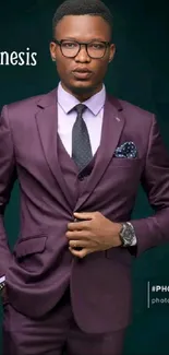 Man in a purple suit standing confidently against a dark background.