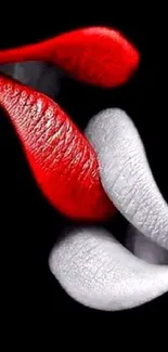 Red and white lips on a black background wallpaper.