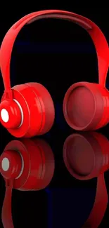 Bright red headphones on black background.