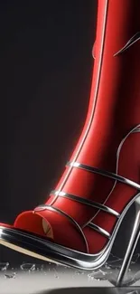 Red high heel with metallic design on dark background.