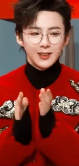 Person in a stylish red jacket with silver details, black turtleneck.