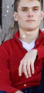 Person in red sweater with sparkles and rustic background.