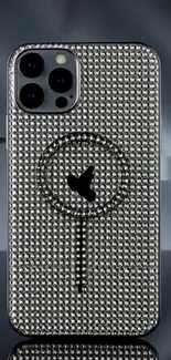 Close-up of a rhinestone-studded phone case with stylish design.
