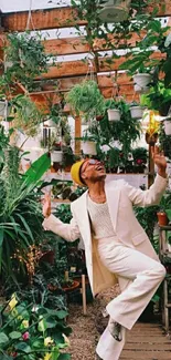 Stylish person in a lush greenhouse with vibrant plants.