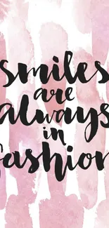 Chic mobile wallpaper with a smile quote on a pink watercolor background.