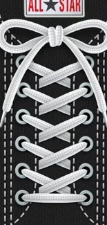 Detailed sneaker lace-up design on a black background