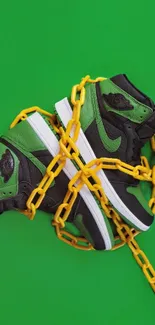 Trendy sneakers with yellow chains on green.