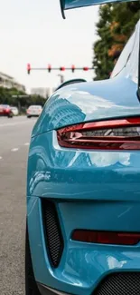 Vibrant blue sports car on city street.