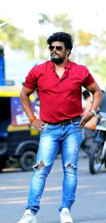 Street style portrait of man in red shirt and jeans.