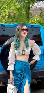 Trendy summer fashion with a blue vehicle and lush greenery in the background.