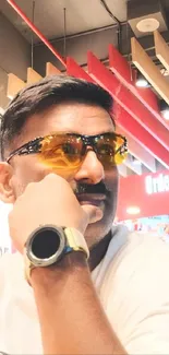 Man wearing sunglasses with stylish background.