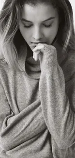 Grey sweater portrait wallpaper of thoughtful woman.