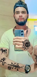 Mirror selfie with stylish tattoos and a cap.