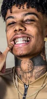 Young stylish man with tattoos smiling, showing grille.