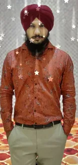 Man in maroon turban with stylish outfit on geometric carpet.