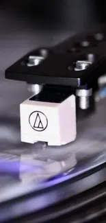 Close-up of turntable needle on a spinning vinyl record.