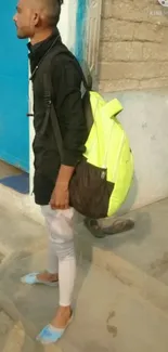 Urban fashion with a bright lime green backpack.