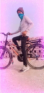 Cyclist on bicycle with purple and pink effects.