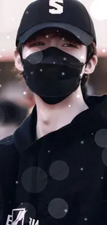 Stylish person in black cap and mask mobile wallpaper.