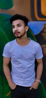 Young man in white t-shirt with graffiti background.