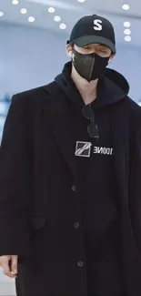 Person in stylish black streetwear fashion outfit.