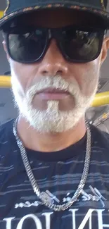 Stylish man in sunglasses on a bus, urban vibe.