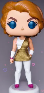 Vinyl figure with golden outfit and brown hair on a wallpaper background.