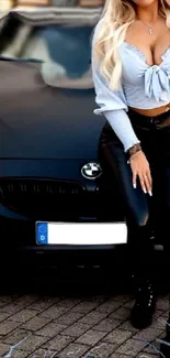 Fashionable woman leaning on black car.