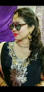 Fashionable woman in traditional festive attire and jewelry.