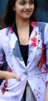 Fashionable woman in a floral blazer with a chic and stylish look.