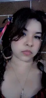 Portrait of a woman with braided pigtails and stylish accessories.