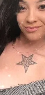 Woman with black hair and a star tattoo, looking stylish.