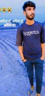 Young man in a blue field with casual outfit