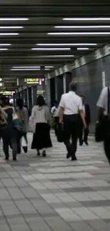 A bustling subway station corridor filled with commuters.