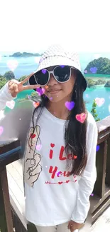 Girl in sunglasses at tropical paradise with heart effects.