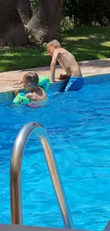 Kids enjoying a sunny day at the poolside.