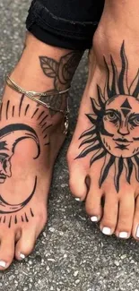 Close-up of sun and moon tattoos on feet on a textured background.