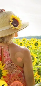 Woman in sunflower field with straw hat and sunny sky.