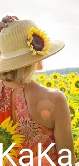 Woman in sunflower field wearing a sun hat.