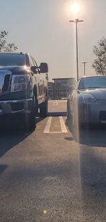 Sunlit view of cars parked in an urban parking lot.