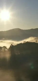 Sunlit mountain mist with sunrise over a serene landscape and peaceful hills.