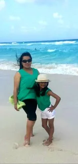 Mother and daughter enjoying a sunny day at the beach.