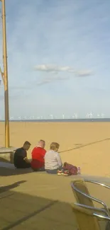 A sunny day at the beach with people relaxing by the ocean.