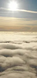 Sunlight breaking through clouds above a serene sky.