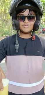 Person with drinks and sunglasses on a sunny road adventure.